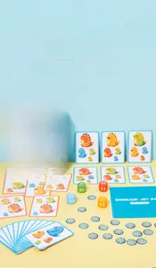 Close-up of Dinosaur Joy Race board game cards, dice, and tokens for kids' logic training