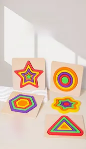 Close-up of rainbow wooden 3D geometric nesting puzzles for early childhood learning