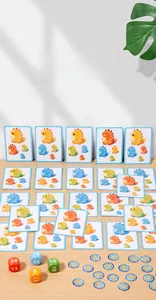 Detailed view of dinosaur educational cards with colorful dice and round game tokens