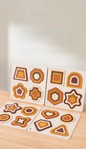Macro detail of geometric wooden stacking puzzle boards in earthy Morandi tones