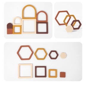Detailed macro view of Morandi-colored silicone geometric stacking blocks for baby early education