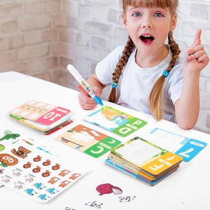 Child using reusable water magic coloring card set with alphabet and animal stickers