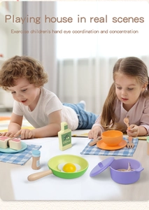 Detailed close-up of kids wooden kitchen toy set featuring simulated cooking play scene