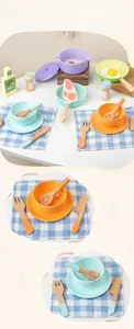 Detail view of macaron-colored wooden kitchen toys with pans, steak, and utensils