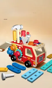 Detail view of wooden fire truck toy with assembly tools like hammer and wrench