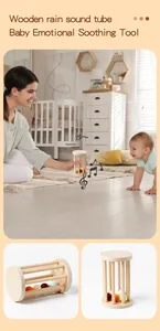 Detail of wooden rain sound tube for baby sensory play with colorful beads inside