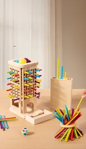 Macro detail of the wooden tower, colorful sticks, and marbles for early education games