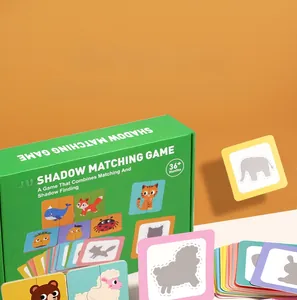Detail of shadow matching puzzle cards featuring animals and green storage box