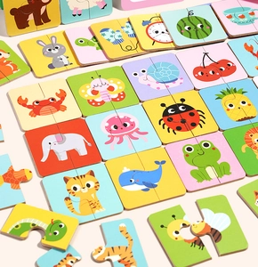 Detail of colorful double-piece educational puzzles featuring cute cartoon animals and fruits