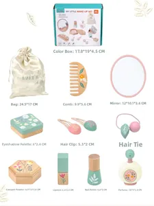 Flat lay of a 11-piece wooden makeup toy set with floral details and storage bag