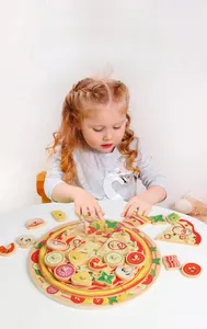 Toddler playing with wooden pizza stacking toy for hand-eye coordination training