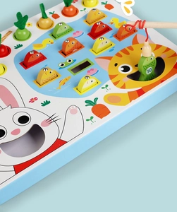 Détail de jouet Montessori en bois avec jeu de pêche magnétique et carottes à planter