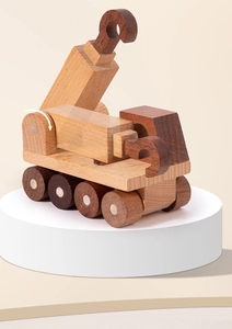 Macro detail of natural wood crane toy featuring rotatable arm and walnut grain finish