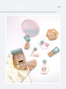 Flat lay of wooden makeup toy set including mirror and hair accessories in pastel colors