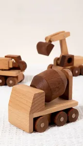 Close-up of premium wooden construction vehicle toys with smooth finish and natural textures