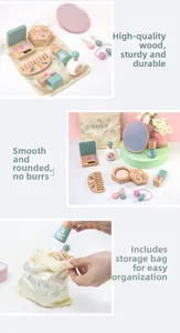 Macro shot of wooden pretend play makeup toys with floral patterns and a canvas bag