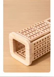 Detail of premium wooden game base showing smooth texture and precise round holes