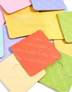 Detail of colorful wooden matching puzzle back featuring various bright pastel colors