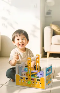 Toddler playing with a wooden educational tool kit box featuring bright yellow components