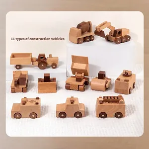 11-piece set of wooden construction toy vehicles including excavators and cranes