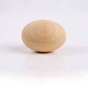 Macro view of solid wood simulation egg toy showing natural grain and smooth texture