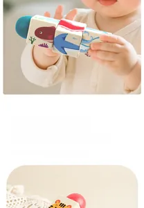 Macro shot of a child holding colorful wooden sea animal blocks for motor skills