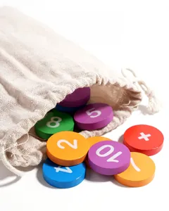 Macro view of colorful wooden math discs with numbers spilling from a linen storage bag