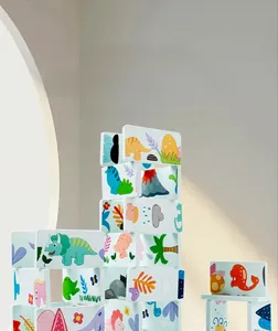 Detail of dinosaur domino building blocks showing interlocking slots and cartoon patterns
