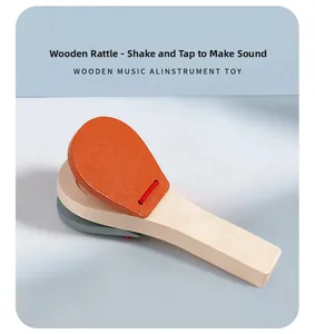 Detail of wooden castanet toy with orange top and natural handle for kids music
