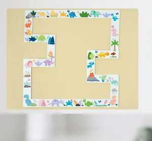 Detail view of colorful cartoon dinosaur domino puzzle pieces on warm background