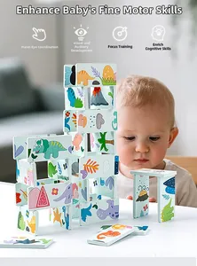 Toddler playing with cartoon dinosaur domino stacking blocks to improve fine motor skills
