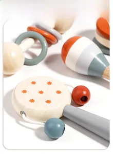 Detailed view of polished wooden baby musical toys with star pattern in Morandi colors