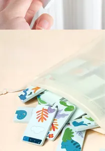 Educational dinosaur puzzle dominoes with a white mesh drawstring storage bag for kids