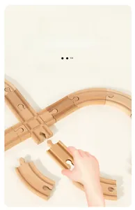 Close-up of natural wood train tracks with modular interlocking puzzle connectors