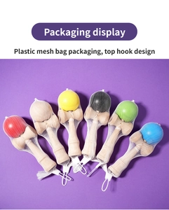 Detailed packaging display of colorful wooden Kendama toys in mesh bags with retail hooks