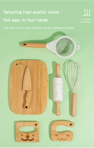 Detailed view of wooden kitchen toys including a rolling pin, whisk, and animal wood blocks
