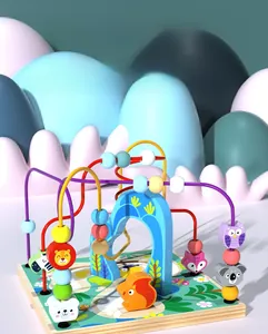Detail of wooden activity cube with animal bead maze and pastel forest base