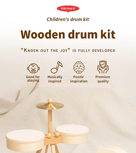 Detail of wooden drum kit for kids with minimalist design and metal cymbal on fabric