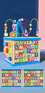 Macro detail of wooden activity cube featuring alphabet blocks and bead maze puzzle