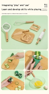 Close-up of kids wooden kitchen tool set showing cutting and whisking real food