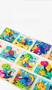 Flat lay view of colorful wooden dinosaur puzzles including T-Rex and Spinosaurus for kids