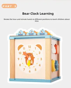 Détail d'une boîte d'activité en bois avec horloge ours et blocs coulissants géométriques