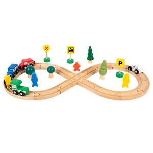 Wooden toy train track set with miniature cars, trees and traffic signs on white background