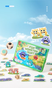 Close-up of Fun Monster Hunt board game including wooden dice and colorful monster cards
