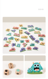 Close-up of colorful monster cards and wooden dice for children educational reaction game