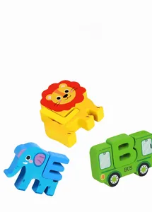 Macro shot of colorful wooden lion, elephant and bus puzzle blocks for toddler learning
