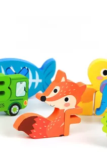 Close-up of smooth 360-degree polished wooden puzzle pieces with animal and letter prints