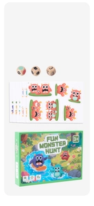 Macro shot of Fun Monster Hunt board game box with wooden dice and cartoon cards