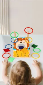 Children hands playing with lion ring toss and bean bag set for motor skill training