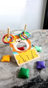 Close-up of kids wooden ring toss and bean bag game with lion board and colorful pieces